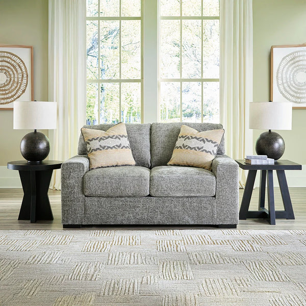 Plush loveseat with deep seating and reversible cushions for comfort.