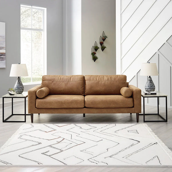 Small-scale caramel faux leather sofa with retro-inspired design ��� Ashley UAE.