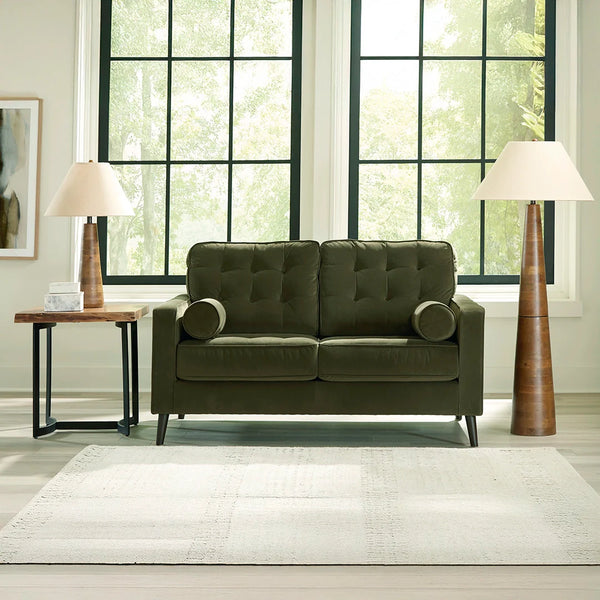 Reveon Lakes loveseat with rich polyester velvet upholstery and button-tufted attached back cushions.