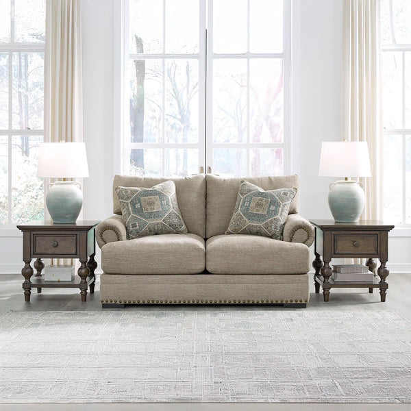 Loveseat with soft polyester upholstery and reversible seat and back cushions.