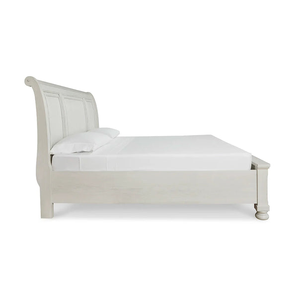 Close-up of Robbinsdale headboard with elegant curved design and oak veneer texture – Ashley UAE