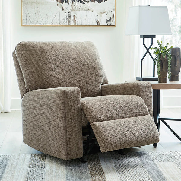 Comfortable dark beige recliner chair with gentle rocking motion and plush upholstery ��� Ashley UAE