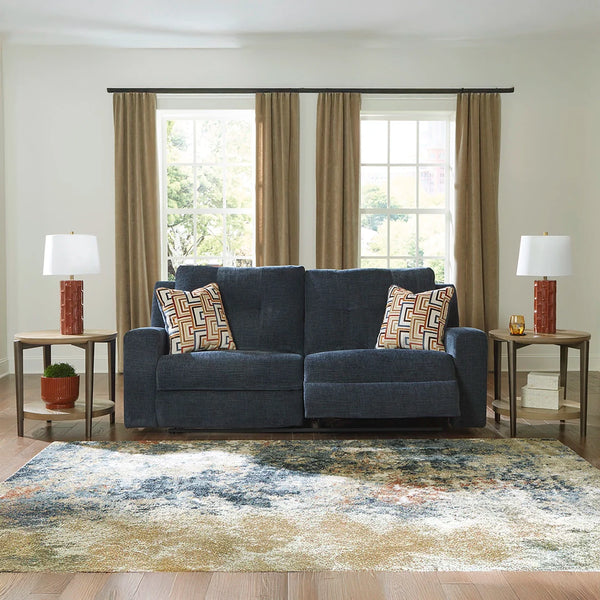 Zero wall recliner sofa with plush cushions and stylish accent pillows.