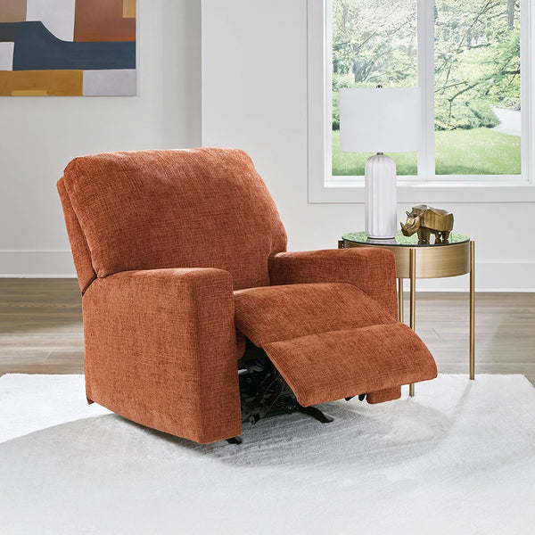 Burnt orange rocker recliner with pull tab reclining and plush cushions ��� Ashley UAE