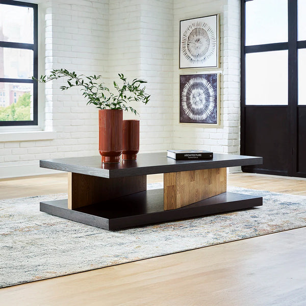 Kocomore coffee table with cantilevered top, angled plinths, and dual-tone oak veneer finish.