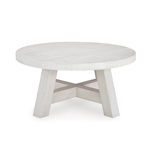 Elegant round coffee table with two coordinating end tables.