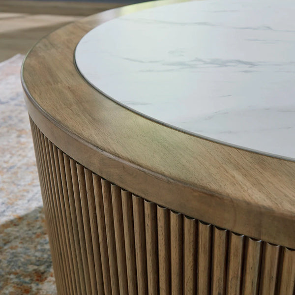 Ashley UAE Camdill coffee table ��� faux marble and light wood-tone finish