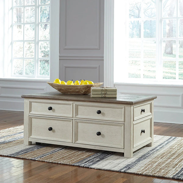 Bolanburg lift-top coffee table with two-tone antiqued finish, weathered oak top, and antique white base.